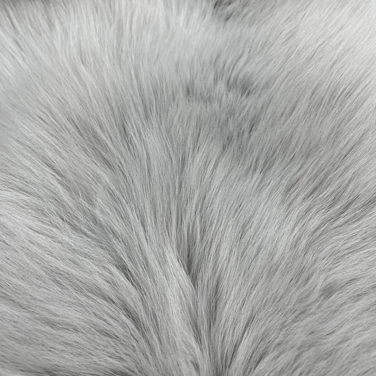 Close-up image of light grey dyed shadow fox fur.
