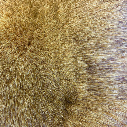 Close-up of a section of dyed Norwegian blue fox fur, showcasing the texture and color.