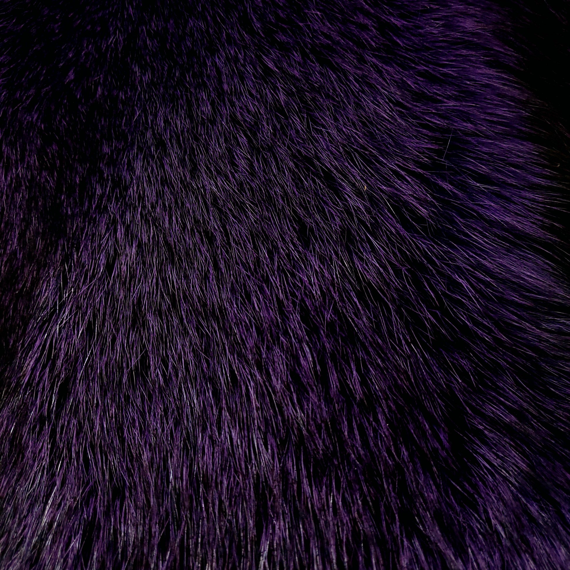 Close-up of a gucci purple dyed fox fur fabric