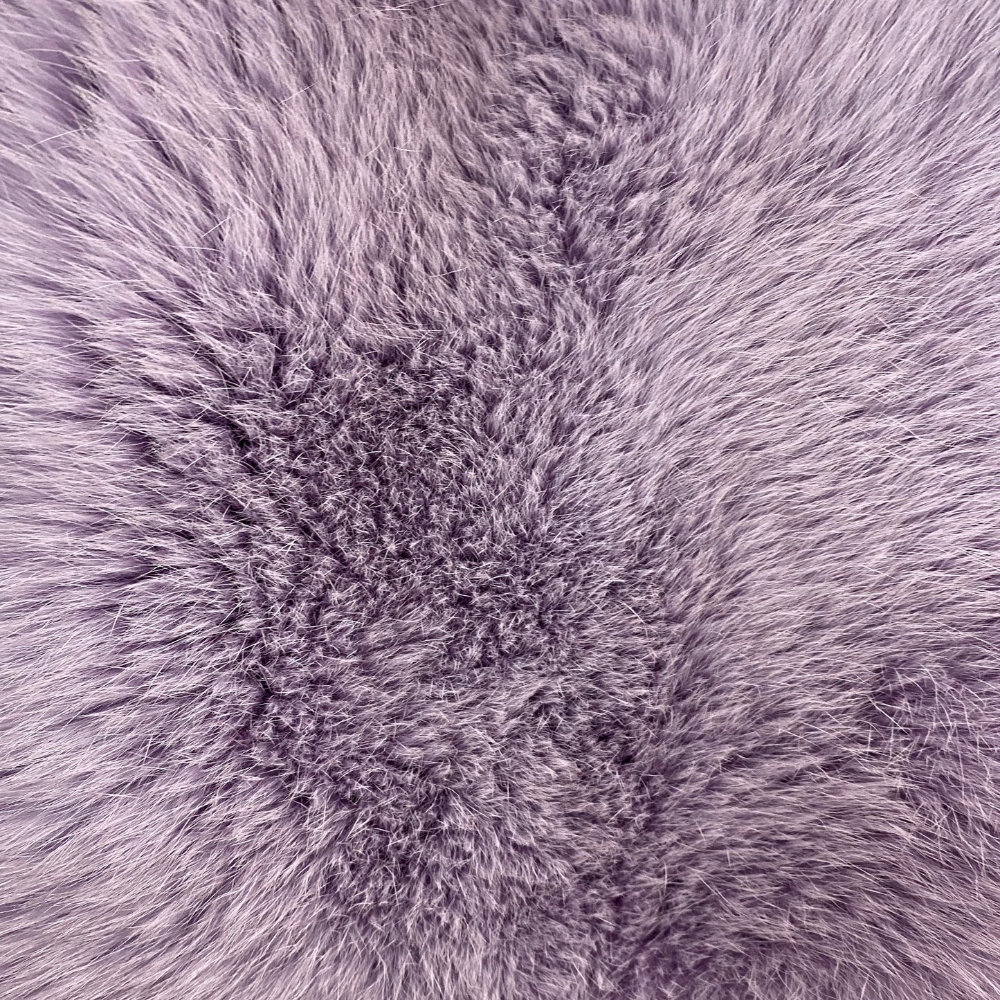 Close-up of lavender colored dyed shadow fox fur fabric
