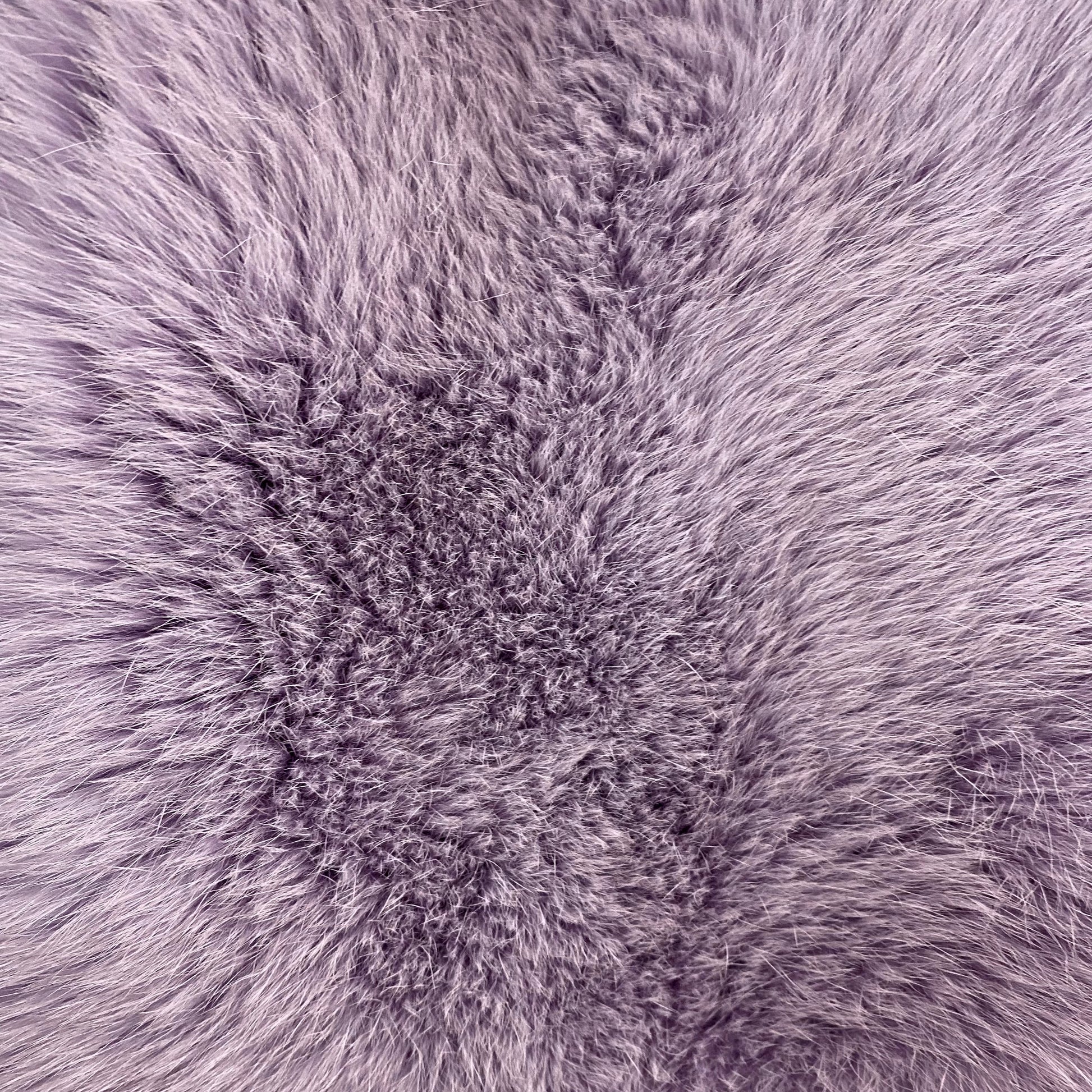 Close-up of lavender colored dyed shadow fox fur fabric