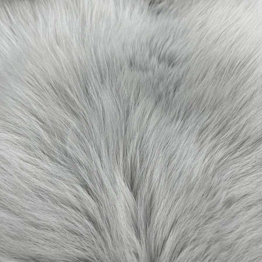Close-up image of light grey dyed shadow fox fur.